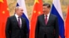 FILE - Chinese President Xi Jinping and Russian President Vladimir Putin meeting in Beijing, Feb. 4, 2022.