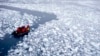 FILE - In this Jan. 22, 2015, photo, a zodiac carrying a team of international scientists heads to Chile's station Bernardo O'Higgins, Antarctica. 