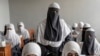 Afghan girls attend a religious school that remained open since the last year's Taliban takeover, in Kabul, Afghanistan, Aug. 11, 2022. For most teenage girls in Afghanistan, it's been a year since they set foot in a classroom. 