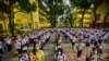 Students attend a flag-raising ceremony before singing the national anthem on the first day of in-person classes after pandemic lockdowns at Pedro Guevara Elementary School in Manila on Aug. 22, 2022. 