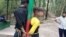 খুঁটির সঙ্গে বেঁধে রাখা দুই শিশু।