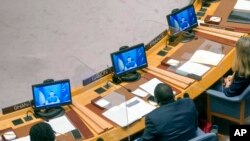 FILE - Ukrainian President Volodymyr Zelenskyy addresses the Security Council via video link during a meeting on threats to international peace and security, at United Nations headquarters, Aug. 24, 2022.