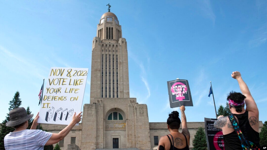 FILE - Protesters line the street around the front of the Nebraska State Capitol during an abortion rights rally held on July 4, 2022, in Lincoln, Neb.