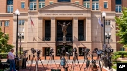 Cameras are set up outside the U.S. District Courthouse before the sentencing of El Shafee Elsheikh in Alexandria, Virginia, Aug. 19, 2022. 