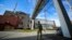 FILE - A Russian serviceman guards an area of the Zaporizhzhia Nuclear Power Station on territory under Russian military control, in southeastern Ukraine, May 1, 2022. 