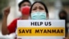 FILE - Myanmar citizens protest against the military coup in front of the UN office in Bangkok, Thailand Feb. 17, 2021.