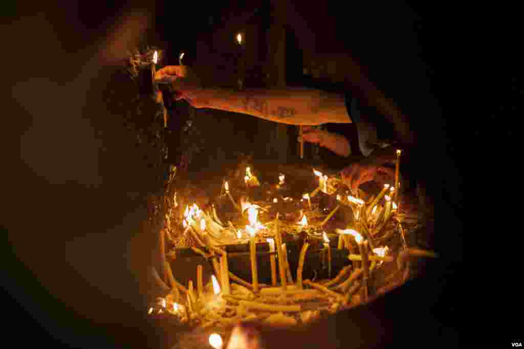 Following the Giza church tragedy, firefighters were stationed in and around the monastery, including alongside candlelit shrines, public cafeterias, and electric generators. Near Assuit, on August 20, 2022. (Hamada Elrasam/VOA)