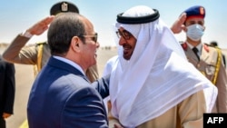 FILE - UAE President Sheikh Mohamed bin Zayed al-Nahyan meets Egyptian President Abdel Fattah al-Sisi upon arrival in Alamein, August 21, 2022. Courtesy image : UAE's Ministry Of Presidential Affairs