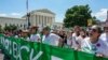 FILE - Abortion rights activists march past United States Supreme Court to protest the court's ruling overturning the landmark Roe v.Wade abortion decision, in Washington, June 30, 2022.