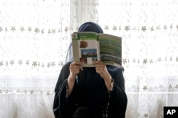 Afghan girl attends a class in an underground school, in Kabul, Afghanistan, Saturday, July 30, 2022. (AP Photo/Ebrahim Noroozi)