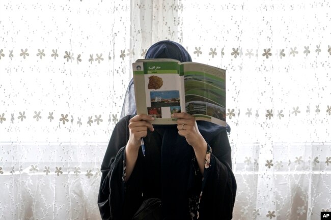 Afghan girl attends a class in an underground school, in Kabul, Afghanistan, Saturday, July 30, 2022. (AP Photo/Ebrahim Noroozi)