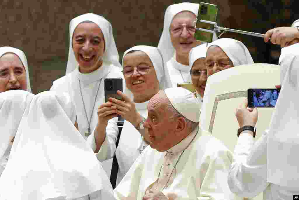 Pope Francis greets a group of nuns at the end of his weekly general audience at the Vatican. (AP Photo/Riccardo De Luca)