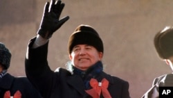FILE - Soviet leader Mikhail Gorbachev waves from the parade review stand of the Lenin Mausoleum on Nov. 7, 1987 in Moscow's Red Square during the 70th anniversary of the Russian Revolution.