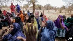 World Food Program chief David Beasley meets with villagers in the village of Wagalla in northern Kenya Friday, Aug. 19, 2022. (AP Photo/Brian Inganga)