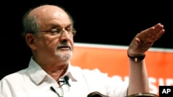 FILE — Author Salman Rushdie talks about the start of his writing career, during the Mississippi Book Festival, in Jackson, Miss., on Aug. 18, 2018. 