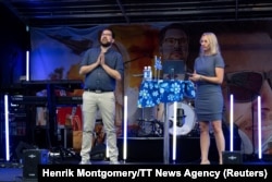 Member of the European Parliament (MEP) Jessica Stegrud of the Sweden Democrats party and the party's leader Jimmie Akesson attend an election campaign meeting ahead of the September 11 Swedish general elections, at the town square in Gavle, Aug. 23, 2022