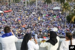 FILE - Thousands gather outside Managua Cathedral during a "peace and justice" rally organized by the Catholic Church, in Managua, Nicaragua, April 28, 2018. (AP Photo/Alfredo Zuniga, File)