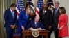 President Joe Biden signs the Democrats' landmark climate change and health care bill in the State Dining Room of the White House in Washington, Aug. 16, 2022.