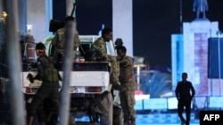 Security forces patrol near the Hayat Hotel after an attack by Al-Shabaab fighters in Mogadishu, Somalia.