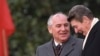 FILE - U.S. President Ronald Reagan, right, talks with Soviet leader Mikhail Gorbachev during arrival ceremonies at the White House where the superpowers held summit talks in Washington, D.C., Dec. 8, 1987. 