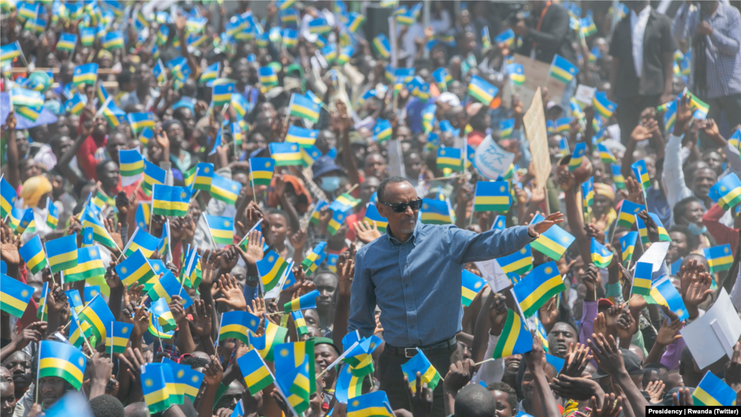 President Paul Kagame of Rwanda stands amid a cheering crowd in Ruhango district southern Rwanda