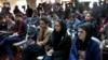 FILE - Afghan Journalists attend a press conference of a former president Hamid Karzai in Kabul, Afghanistan, Feb. 13, 2022.