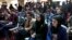 FILE - Afghan Journalists attend a press conference of a former president Hamid Karzai in Kabul, Afghanistan, Feb. 13, 2022.