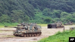 South Korean army K-9 self-propelled howitzers take positions in Paju, near the border with North Korea, South Korea, Aug. 22, 2022. The US and South Korea began their biggest combined military training in years Monday as they heighten their defense postu