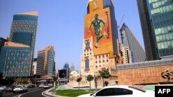 FILE: A poster of Senegal's forward Sadio Mane, whose team qualified for the FIFA 2022 World Cup, adorns a building in the Qatari capital Doha on August 16, 2022.