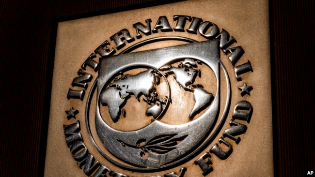 FILE - The logo of the International Monetary Fund is visible on their building, April 5, 2021, in Washington.