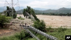 Damaged electrical towers during the floods in Mingora, the capital of Swat valley in Pakistan, Aug. 27, 2022. Flash flooding has displaced thousands of people since mid-June.