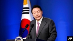 FILE - South Korean President Yoon Suk Yeol delivers a speech during a news conference to mark his first 100 days in office at the presidential office in Seoul, South Korea, Aug. 17, 2022.