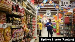 FILE: A customer shops at a Shoprite store in Johannesburg. Taken Sept. 7, 2013. 