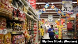 FILE: South Africa woman in a supermarket - Johannesburg grocery store. Taken Sept. 7. 2013