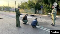 Полиция на месте взрыва автомобиля Дарьи Дугиной (архивное фото)