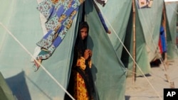 A displaced girl who fled her flood-hit home take refuge in Shikarpur district of Sindh province, Pakistan, Aug. 31, 2022. 