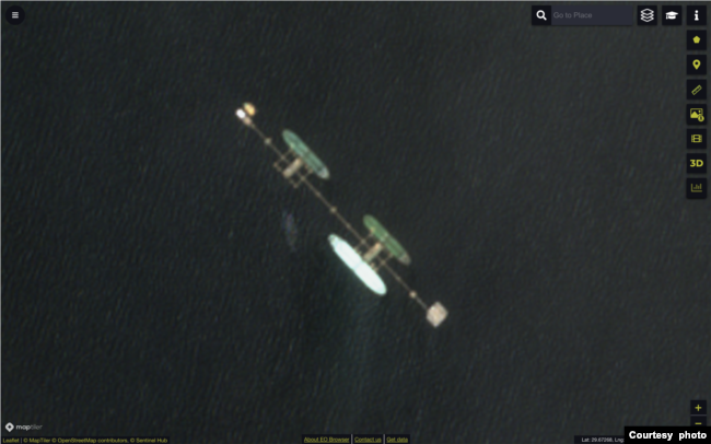 This satellite photo shows what TankerTrackers.com says is oil tanker Ephesos (northernmost of three pictured tankers) occupying a berth at Iraq's offshore Al-Basrah Oil Terminal on Aug. 10, 2022 (ESA)
