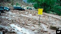 FILE - This photo provided by the National Park Service shows the scene after a flash flood in Zion National Park in Utah on June 30, 2021.