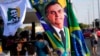 FILE - A banner emblazoned with an image of Brazil's President Jair Bolsonaro, who is a candidate for reelection, is displayed for sale in Brasilia, Brazil, Aug. 2, 2022. 