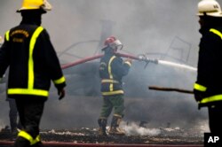 Firefighters work to put out a deadly fire at a large oil storage facility in Matanzas, Cuba, Aug. 9, 2022.