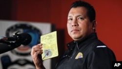Percy Abrams, an Onondaga Eel Clan member and, at the time, executive director of the Iroquois Nationals (today, Haudenosaunee Nationals) lacrosse team showing his Haudenosaunee Confederacy passport during a news conference in New York, Wednesday, July 14, 2010.