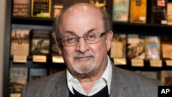 FILE - Author Salman Rushdie appears at a signing for his book "Home" in London on June 6, 2017