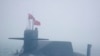 FILE - In this April 23, 2019, photo, a type 094A Jin-class nuclear submarine Long March 10 of the Chinese People's Liberation Army (PLA) Navy participates in a naval parade near Qingdao in eastern China's Shandong province. 