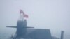 FILE - In this April 23, 2019, photo, a type 094A Jin-class nuclear submarine Long March 10 of the Chinese People's Liberation Army (PLA) Navy participates in a naval parade near Qingdao in eastern China's Shandong province. 