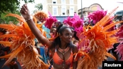 Revellers take part in the Children's Parade at Notting Hill Carnival in London, Aug. 28, 2022. 