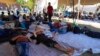 Dutch Agencies Help Migrants Sleeping Outside Crowded Camp 