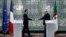 French President Emmanuel Macron, left, and Algeria's President Abdelmadjid Tebboune shake hands at the end of a joint press conference at the presidential palace in Algiers on Aug. 25, 2022. 