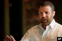 U.S. Rep. Markwayne Mullin (Rep-Ohio) speaks with supporters Tuesday, Aug. 23, 2022, at a luncheon in Norman, Okla.