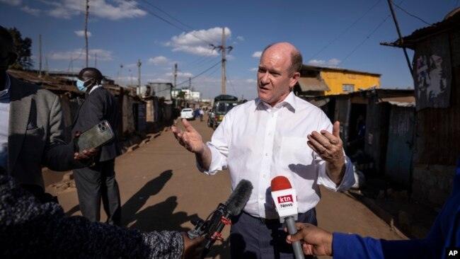 Sen. Chris Coons, leading a U.S. congressional delegation, speaks to The Associated Press in the Kibera neighborhood of Nairobi, Kenya, Aug. 18, 2022.