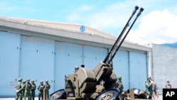 Taiwanese soldiers operate a Oerlikon 35mm twin cannon anti-aircraft gun at a base in Taiwan's southeastern Hualien county on Aug. 18, 2022.